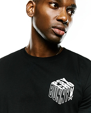 Men's Conan Pima Back Graphic Tee, black classic fit Pima cotton jersey t-shirt with a white 3D-effect Psycho Bunny text logo and small bunny skull on the left chest.