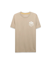 Mens Conan Back Graphic Tee, a classic fit tan jersey t-shirt featuring a large white 3D-effect Psycho Bunny text and skull logo graphic on the left chest, with yellow inner neck tape.