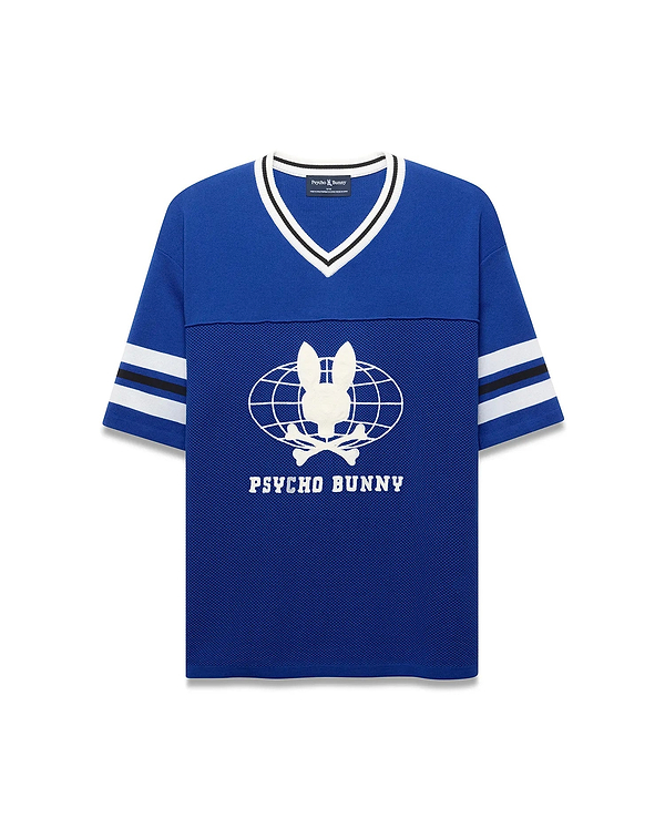 Royal blue Mens Mike Knit Graphic Jersey, relaxed fit, with white/black striped knit V-neck and sleeves. Features a large white Psycho Bunny skull globe graphic and text on the mesh-textured chest. (6)