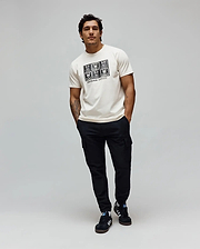 Mens Keon Graphic Tee, ecru classic fit jersey t-shirt with a large black chest graphic featuring a grid of Psycho Bunny skull logos and Psycho Bunny text.