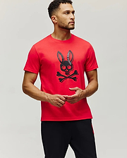 Mens Serge Embroidered Bunny Graphic Tee in vibrant red, featuring a classic fit and a large central black bunny skull and crossbones graphic with Psycho Bunny text on the ear.