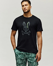 Mens Serge Embroidered Bunny Graphic Tee, black classic fit jersey knit with a large, centered dark grey embroidered Psycho Bunny skull and crossbones logo featuring lime green text.