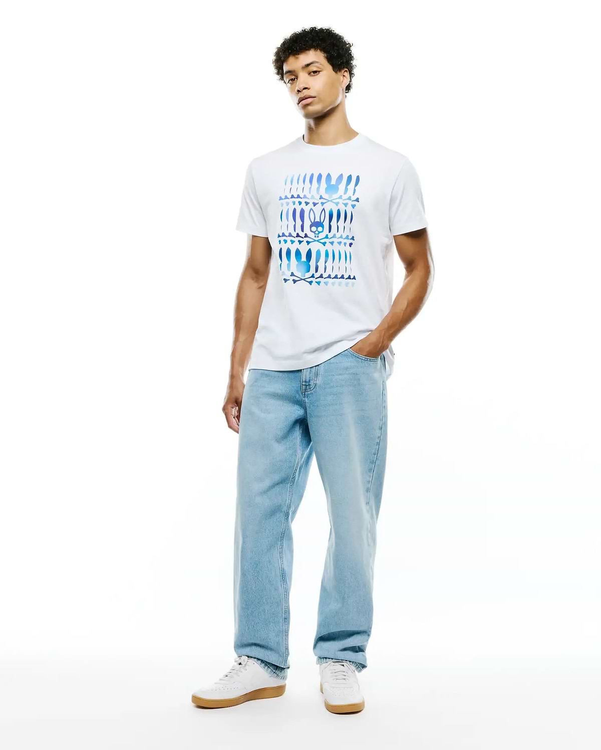 Mens Lewis Graphic Tee, a classic fit white jersey t-shirt featuring a large chest graphic of repeating blue and purple gradient Psycho Bunny skull and crossbones motifs.