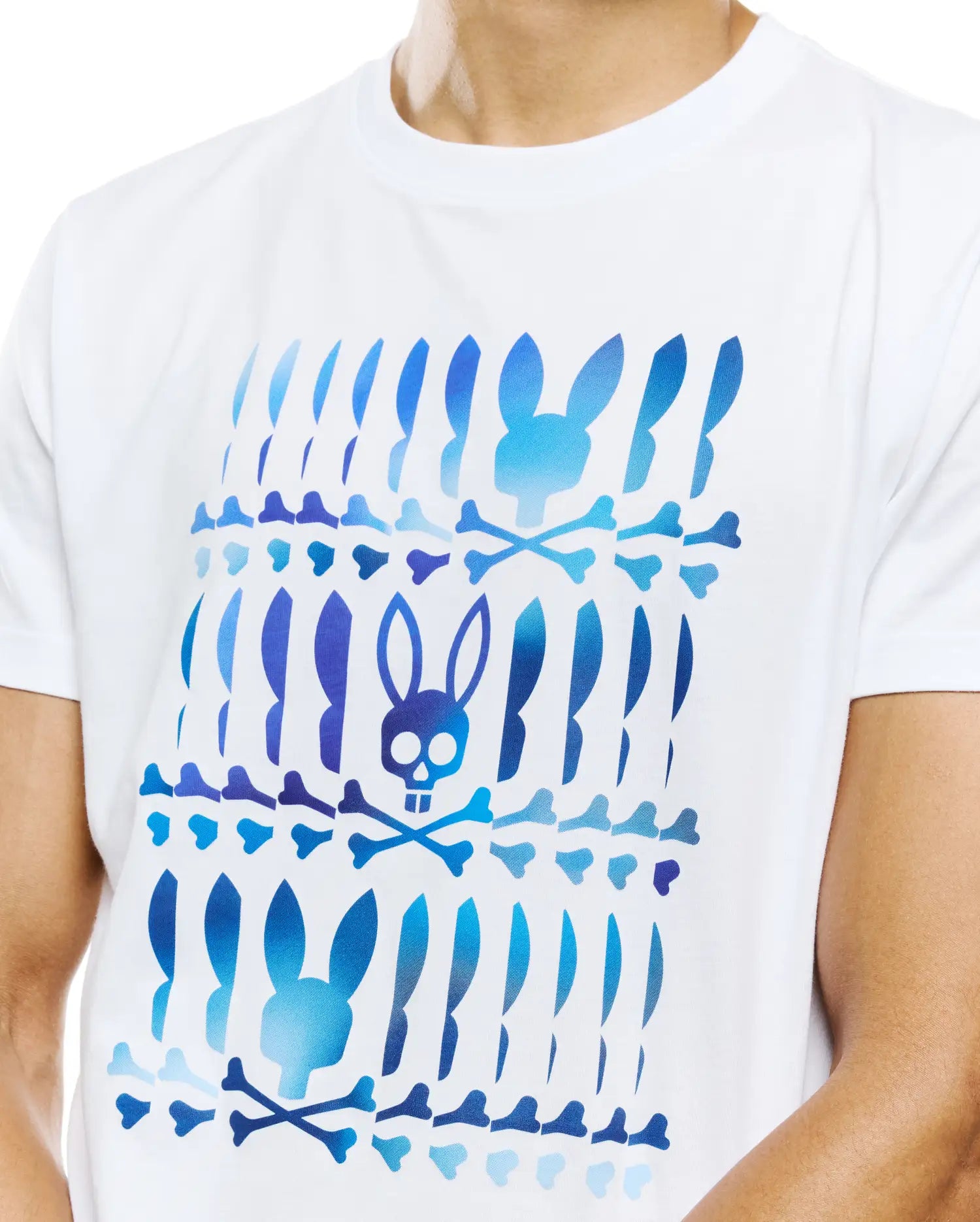 White Mens Lewis Graphic Tee in classic fit, featuring a large blue gradient graphic print of repeating Psycho Bunny skull and crossbones and bunny ear shapes on soft jersey fabric.