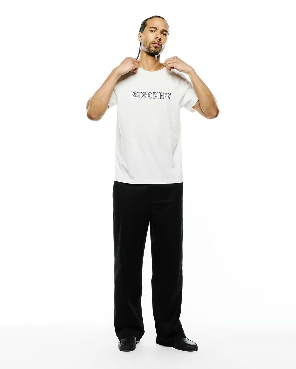 Mens Joji Wordmark Graphic Tee, a premium cream classic fit jersey t-shirt featuring a bold black outline PSYCHO BUNNY wordmark graphic prominently on the chest.