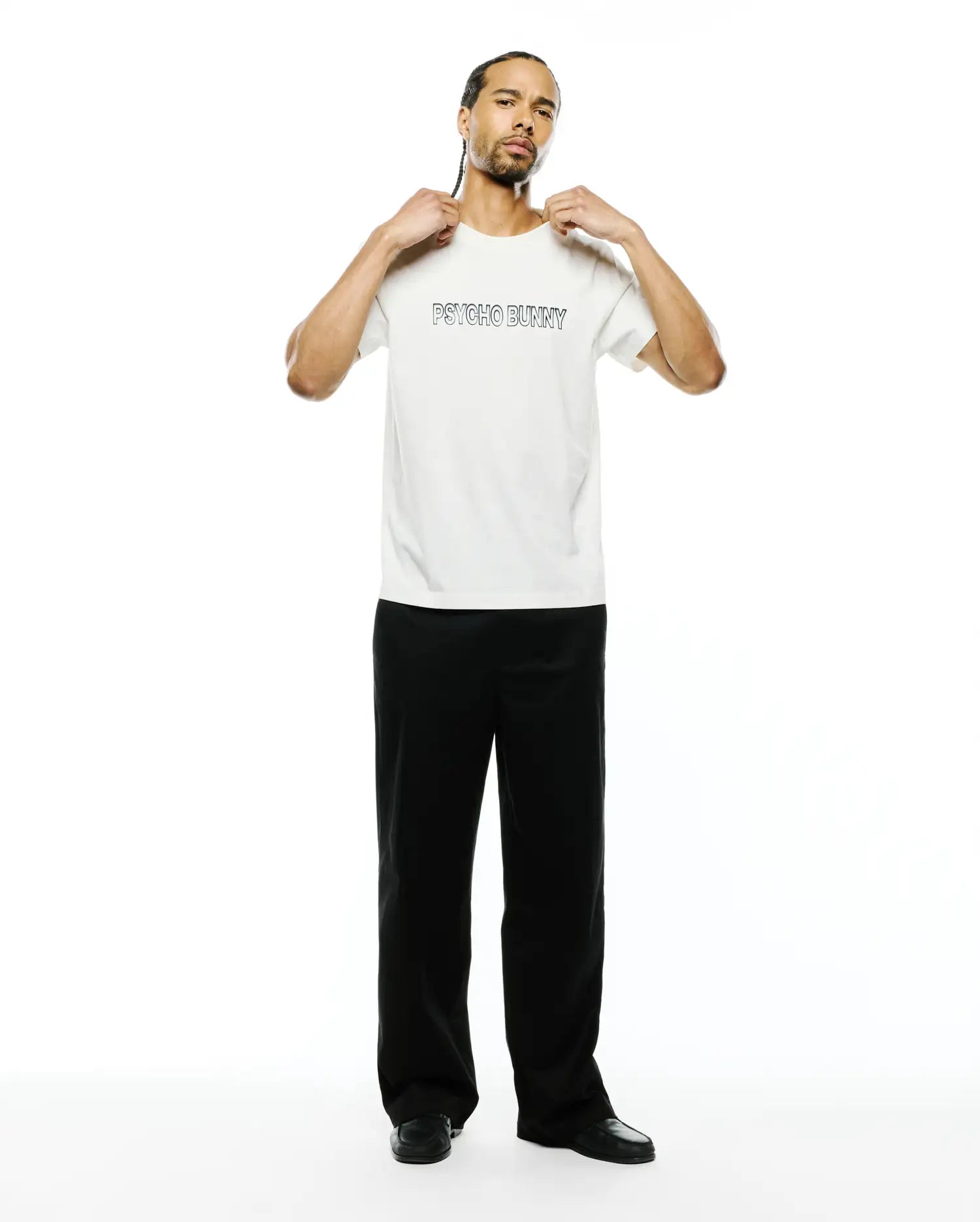 Mens Joji Wordmark Graphic Tee, a premium cream classic fit jersey t-shirt featuring a bold black outline PSYCHO BUNNY wordmark graphic prominently on the chest.