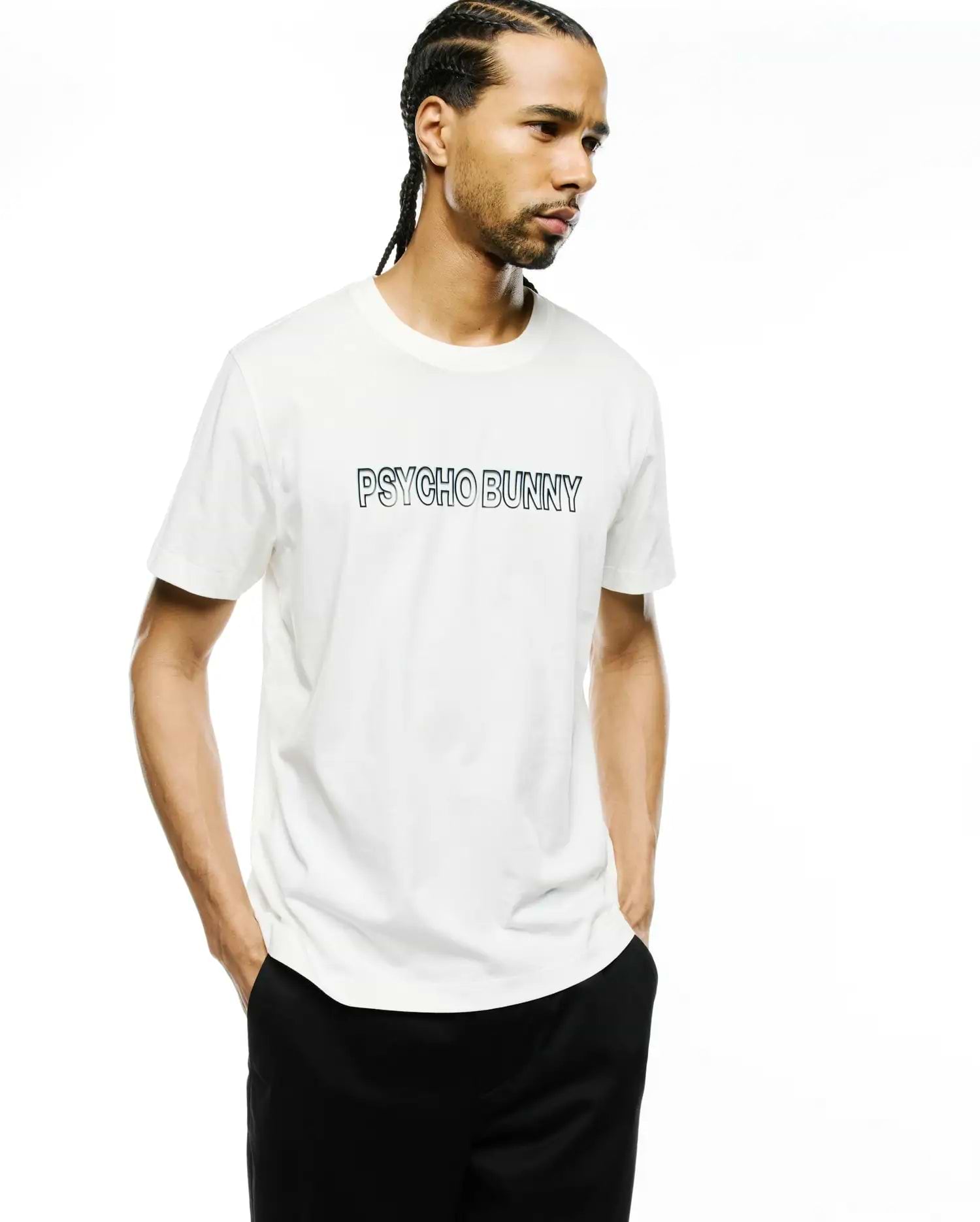 Premium white classic fit short-sleeve jersey t-shirt with a prominent black outline PSYCHO BUNNY wordmark graphic centered on the chest. Mens Joji Wordmark Graphic Tee.