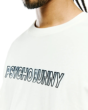 Mens Joji Wordmark Graphic Tee, a classic fit white jersey t-shirt featuring a large central chest graphic of the Psycho Bunny wordmark with a black outline and subtle shadow effect.