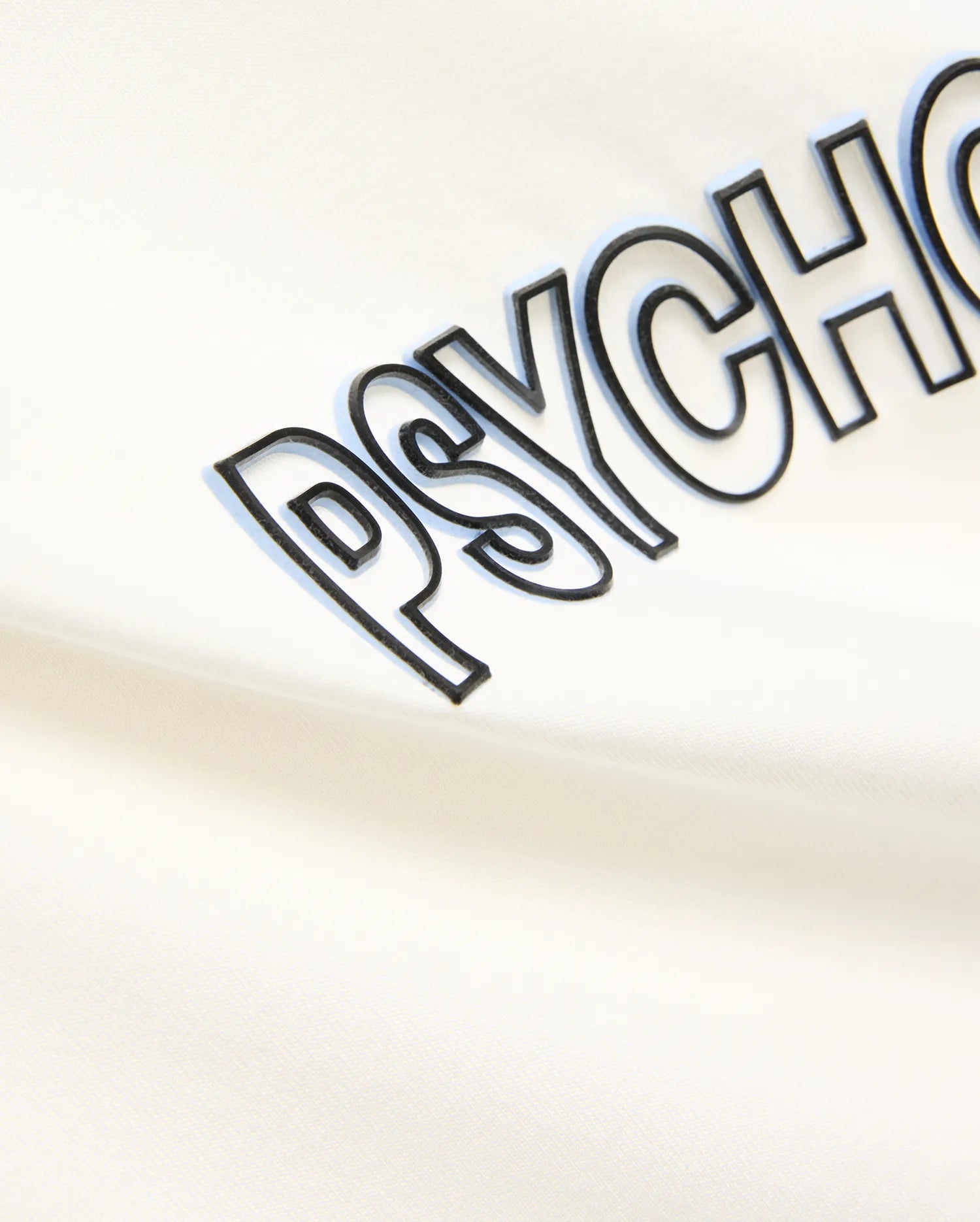 Mens Joji Wordmark Graphic Tee in cream, featuring a large central PSYCHO wordmark graphic with a black outline and light blue shadow effect on soft jersey knit fabric.