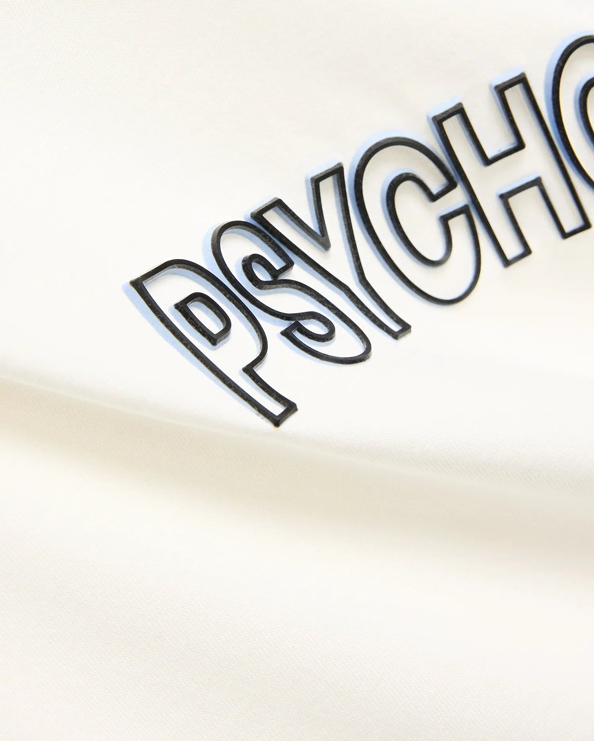 Mens Joji Wordmark Graphic Tee in cream, featuring a large central PSYCHO wordmark graphic with a black outline and light blue shadow effect on soft jersey knit fabric.