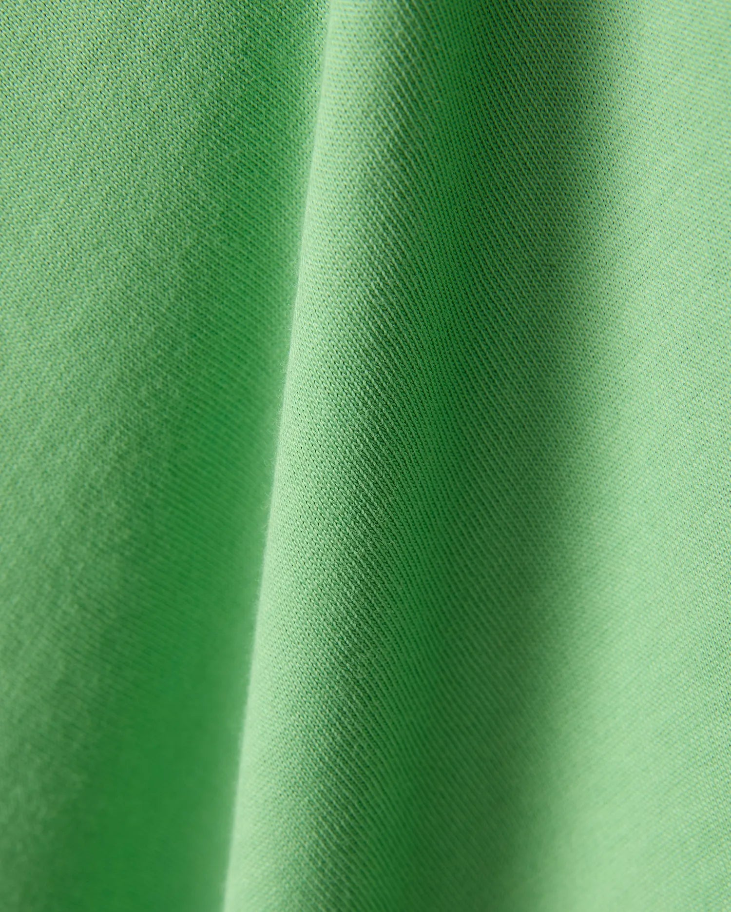 Mens Joji Wordmark Graphic Tee in a vibrant, eye-catching lime green jersey knit fabric, showcasing a fine, soft texture with subtle diagonal ribbing and elegant, flowing folds. (6)