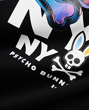 Mens Kenji Pima Cotton Graphic Tee in black jersey, featuring a large white NY graphic with iridescent blue, purple, and pink fill, plus the iconic white Psycho Bunny skull and crossbones logo with gradient ears, and white PSYCHO BUNNY text.