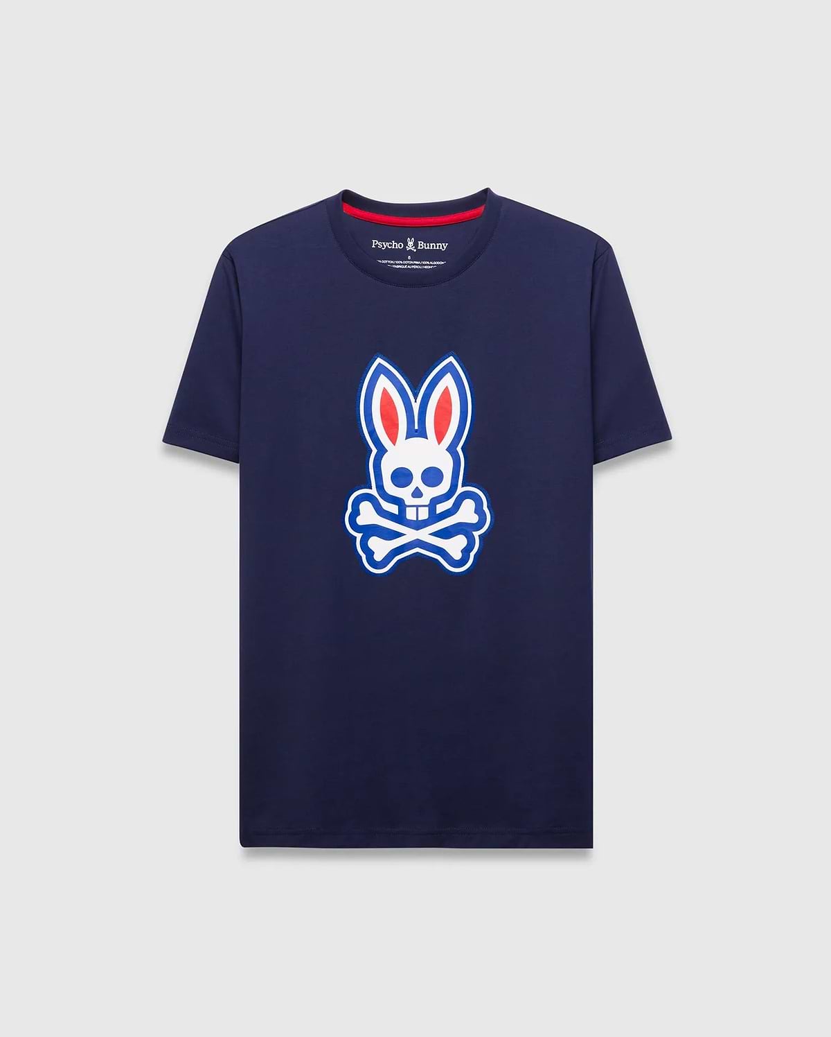 Mens John Graphic Tee, a classic fit navy jersey t-shirt featuring a large white, red, and blue Psycho Bunny skull logo graphic on the center chest and red neck tape.