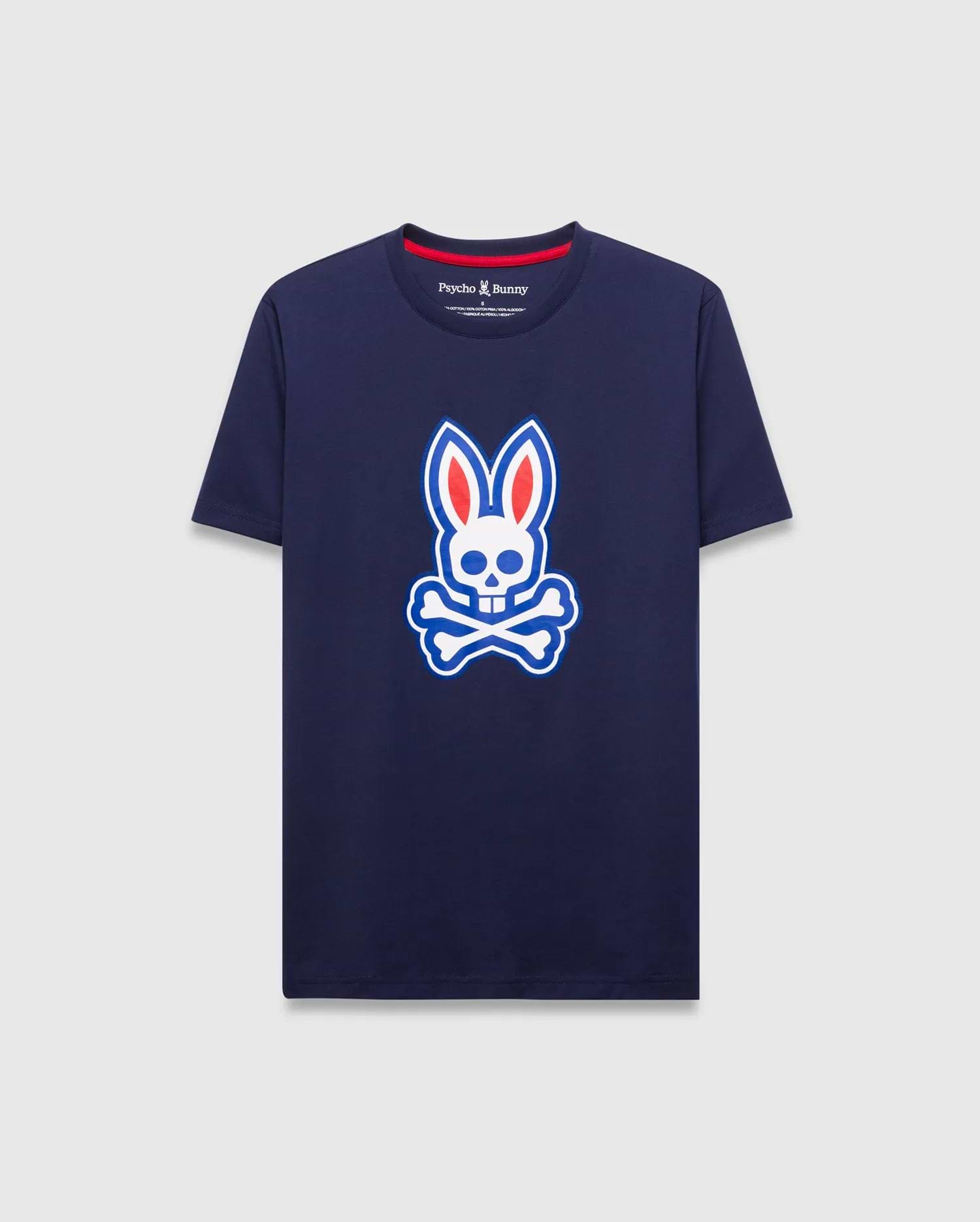 Mens John Graphic Tee, a classic fit navy jersey t-shirt featuring a large white, red, and blue Psycho Bunny skull logo graphic on the center chest and red neck tape.