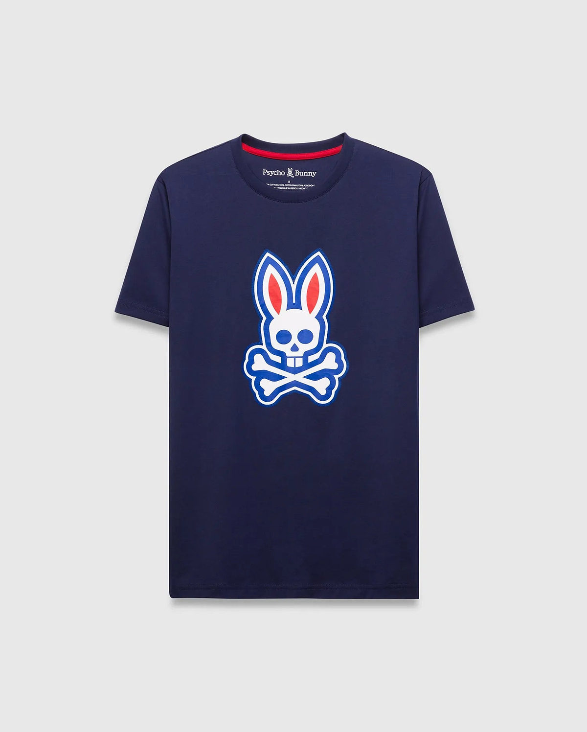Mens John Graphic Tee, a classic fit navy jersey t-shirt featuring a large white, red, and blue Psycho Bunny skull logo graphic on the center chest and red neck tape.