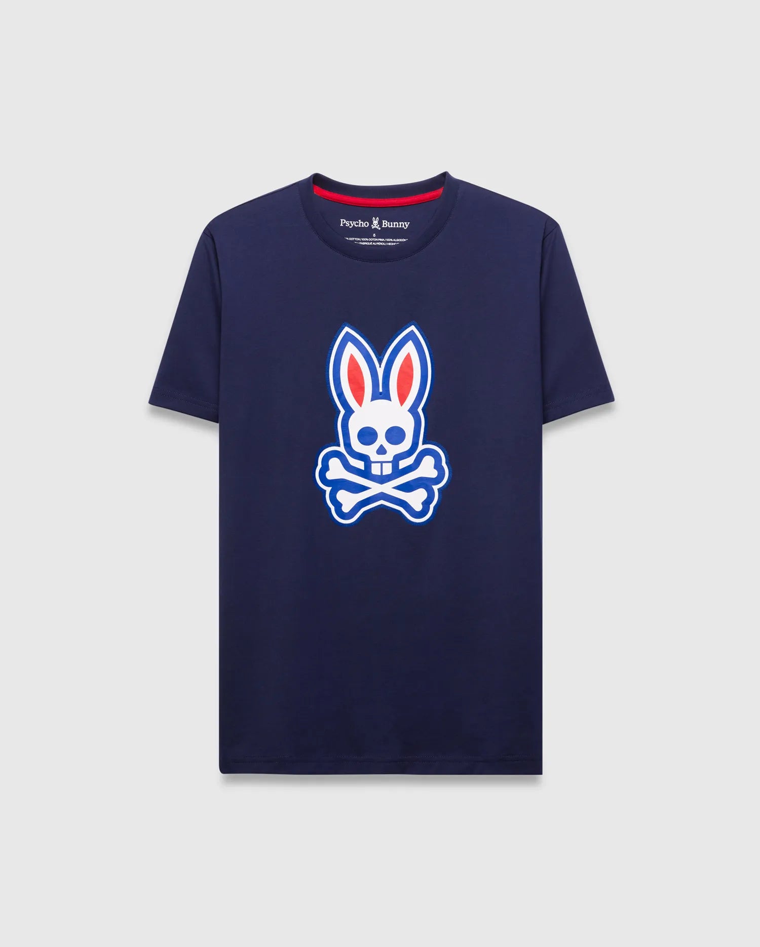 Mens John Graphic Tee, a classic fit navy jersey t-shirt featuring a large white, red, and blue Psycho Bunny skull logo graphic on the center chest and red neck tape.
