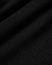 Psycho Bunny Mens Taylor Pique Tee in rich black, highlighting the premium, breathable pique knit fabric texture with subtle, elegant folds and shadows, perfect for refined streetwear.