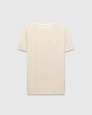 Mens Taylor Pique Tee in cream, featuring a classic fit and subtle pique texture. A small, white embroidered Psycho Bunny skull logo adorns the left chest.