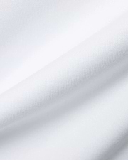 Mens Olek Relaxed Back Graphic Tee, showcasing its pristine white, premium jersey knit fabric with a soft, breathable texture and elegant, gently flowing folds. (6)