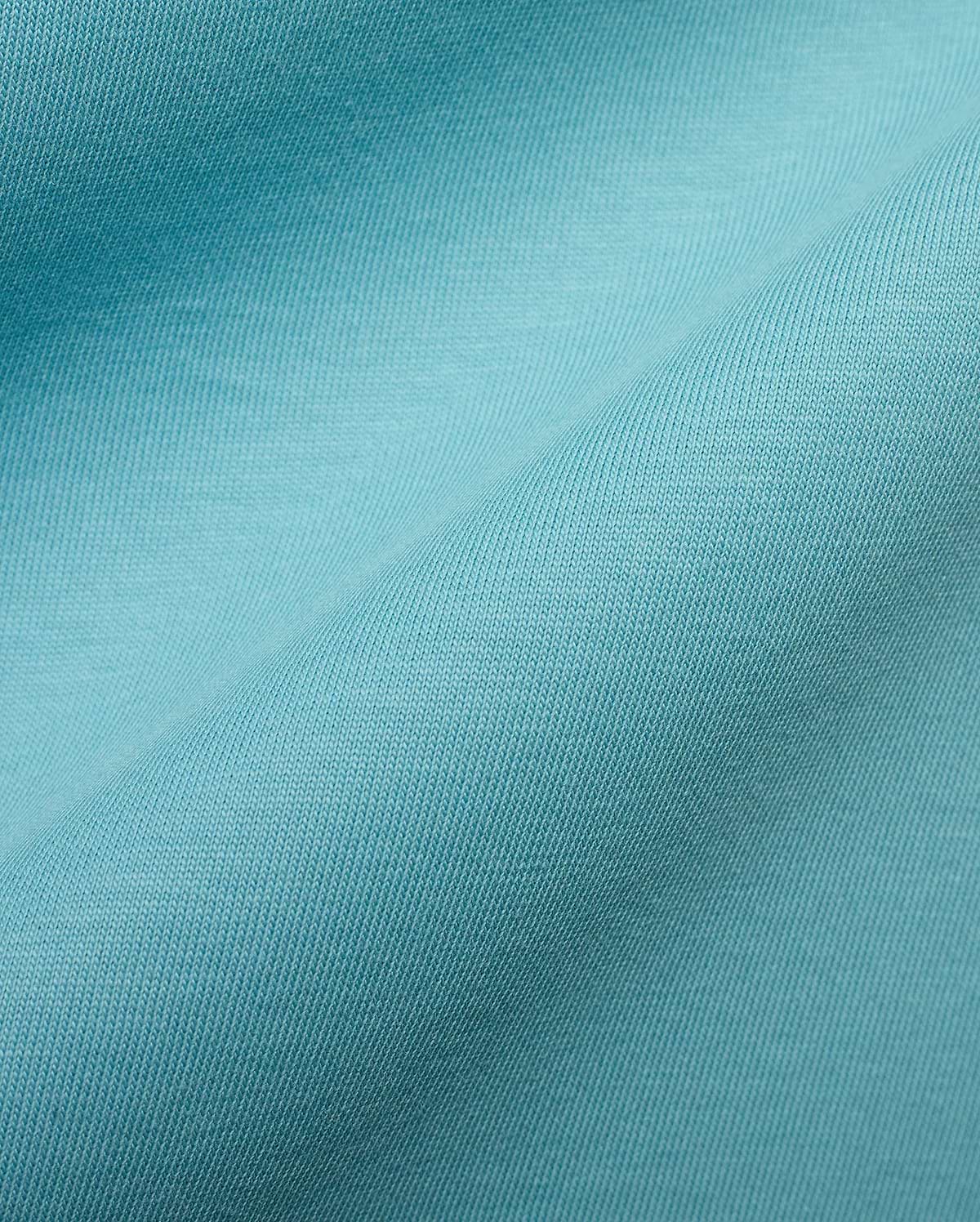 Men's Alfie Back Graphic Tee featuring a rich, vibrant turquoise soft jersey knit fabric with a finely woven, subtle diagonal texture, characteristic of premium Psycho Bunny apparel. (6)