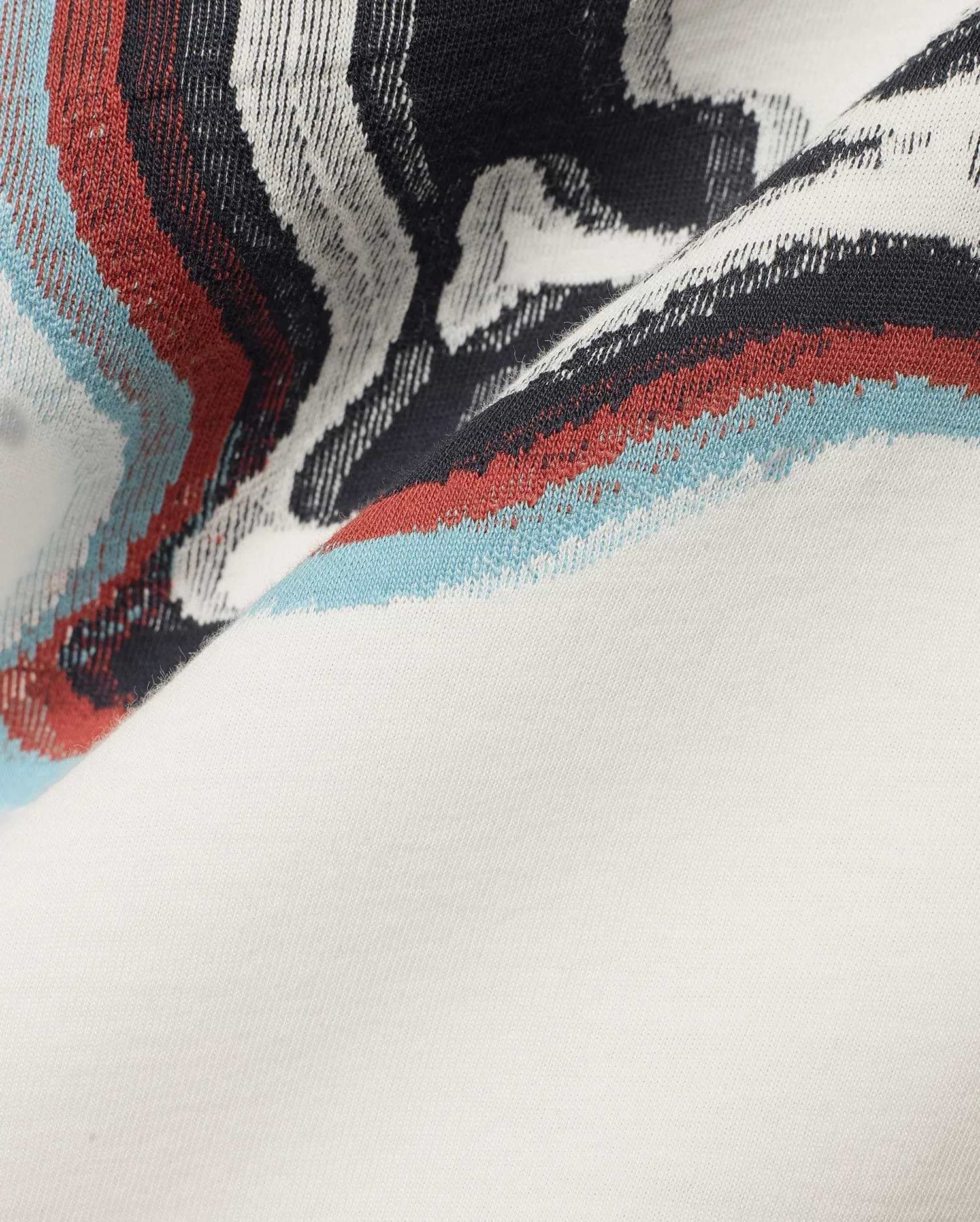 Men's Klaus Jacquard Tee featuring a cream jersey knit base with a bold jacquard pattern of black, white, red, and light blue wavy stripes. (6)