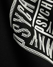 Men's Raj Wordmark Graphic Tee, a black jersey t-shirt featuring a prominent white graphic print with a unique textured dotted effect on parts of the Psycho Bunny wordmark. (6)