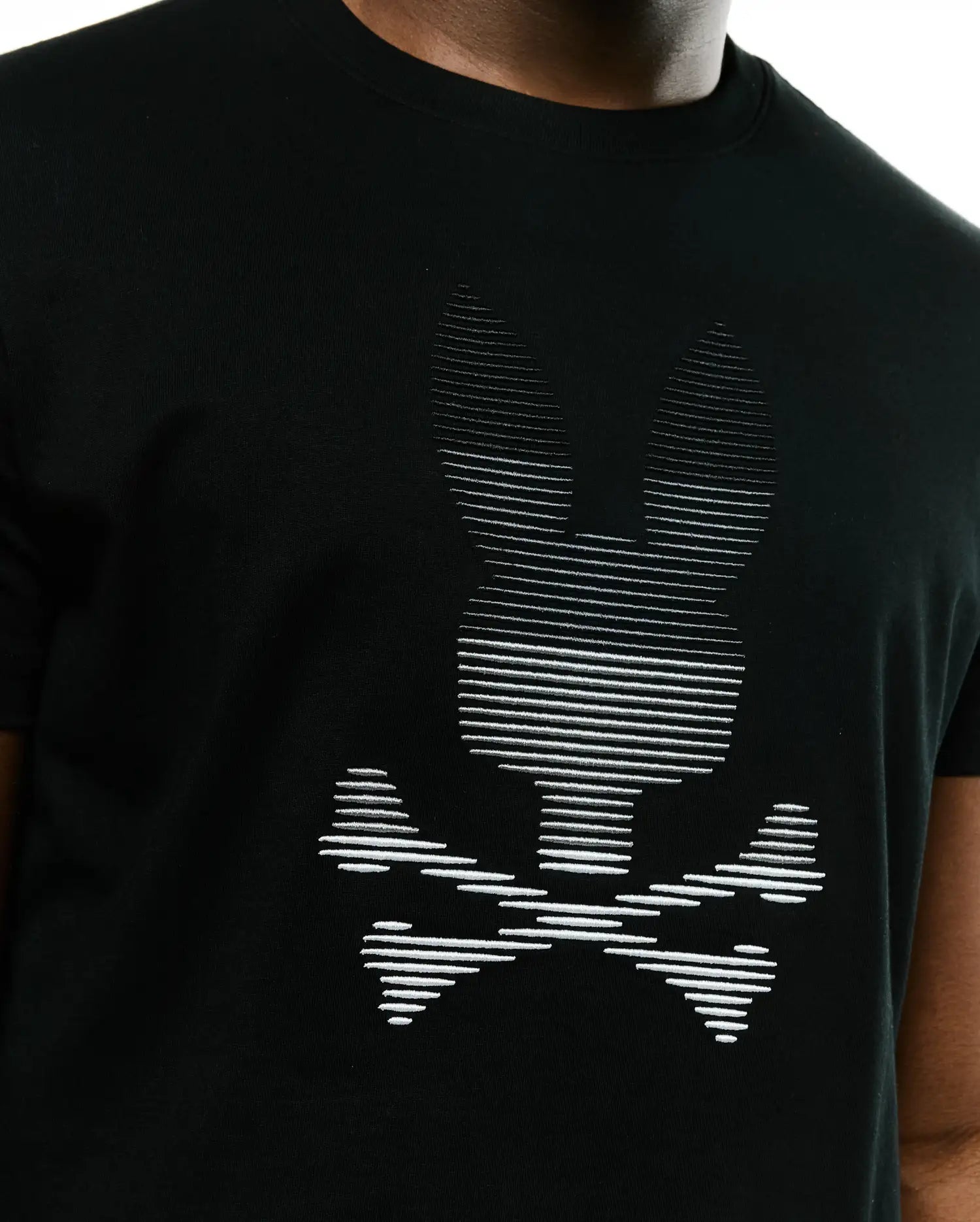 Men's Slade Bunny Graphic Tee, a black classic fit jersey knit t-shirt with a large white Psycho Bunny skull logo graphic on the chest, detailed with horizontal lines. (3)