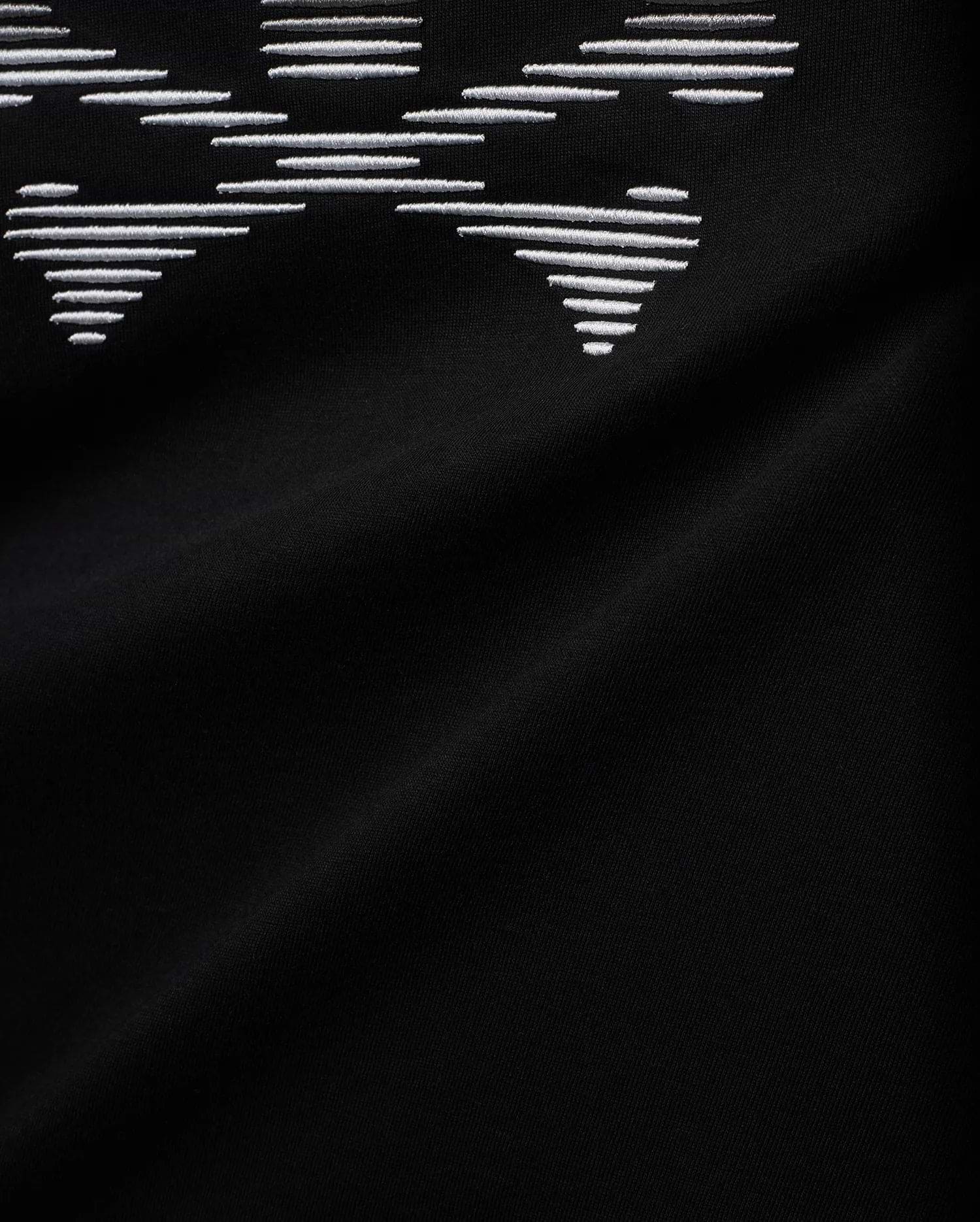 Men's Slade Bunny Graphic Tee, a black smooth jersey knit with a prominent, large white embroidered bunny skull graphic, intricately formed by horizontal lines. (6)