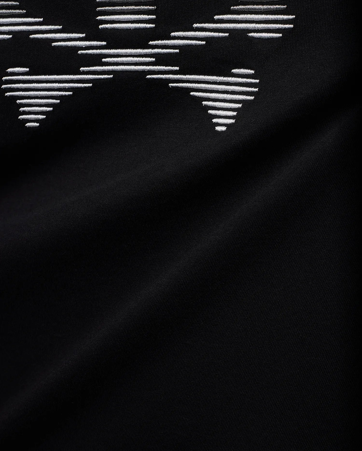 Men's Slade Bunny Graphic Tee, a black smooth jersey knit with a prominent, large white embroidered bunny skull graphic, intricately formed by horizontal lines. (6)