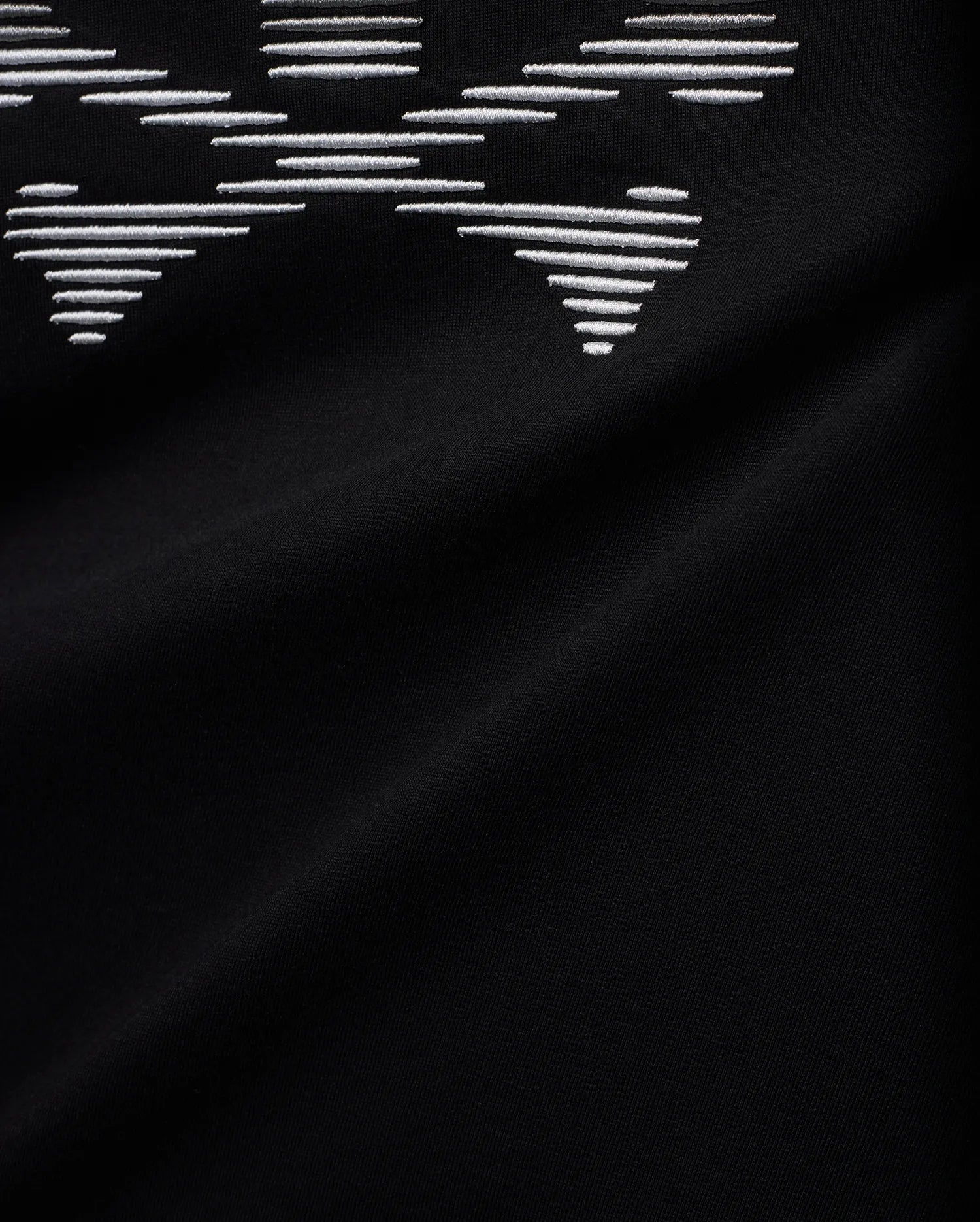 Men's Slade Bunny Graphic Tee, a black smooth jersey knit with a prominent, large white embroidered bunny skull graphic, intricately formed by horizontal lines. (6)