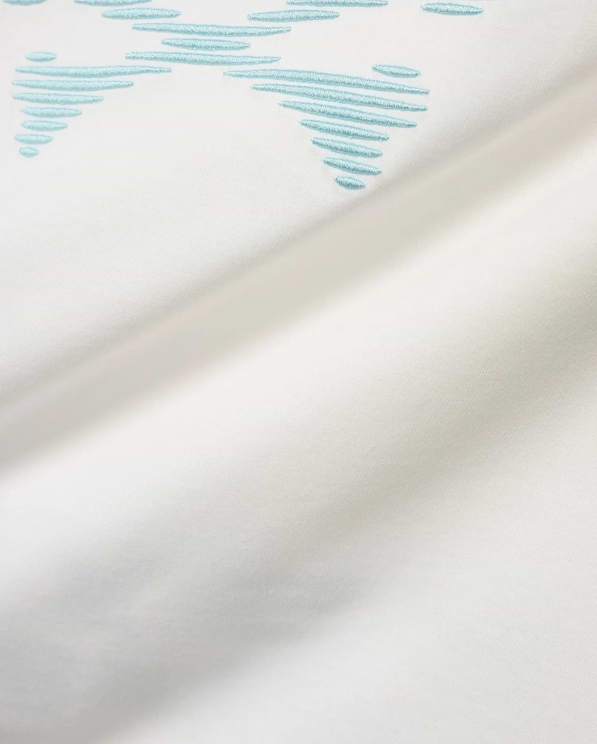 Men's Slade Bunny Graphic Tee, a white smooth jersey t-shirt featuring a prominent light blue embroidered stylized bunny skull graphic formed by horizontal lines. (6)