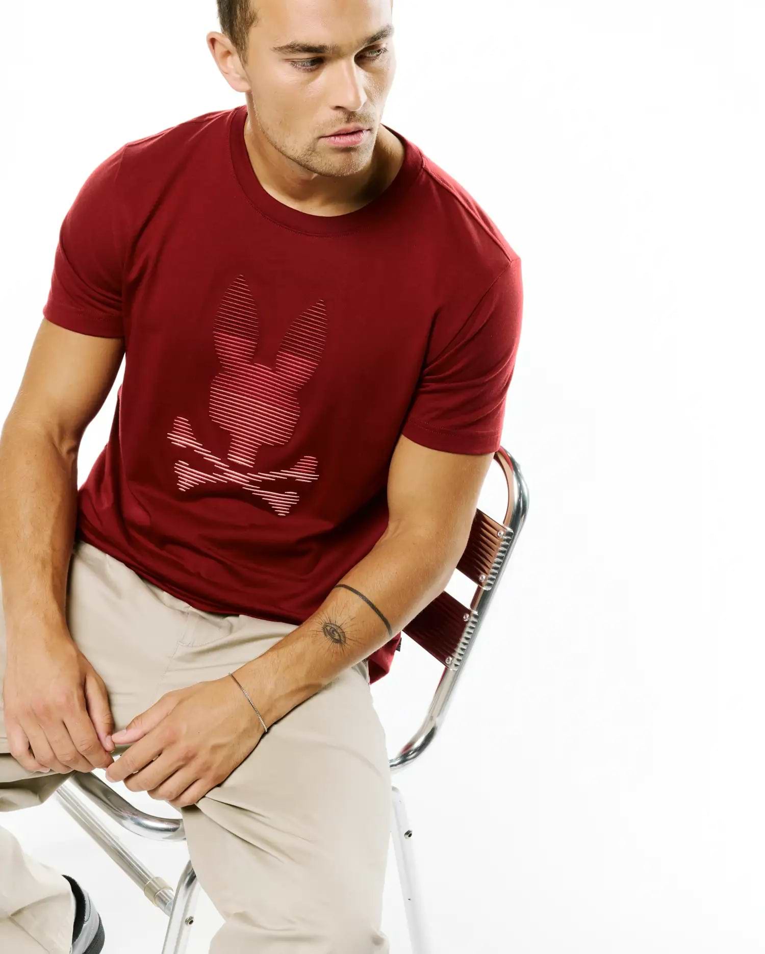 Men's Slade Bunny Graphic Tee, a classic fit maroon jersey t-shirt featuring a large, iconic tonal striped Psycho Bunny skull graphic on the center chest. (4)