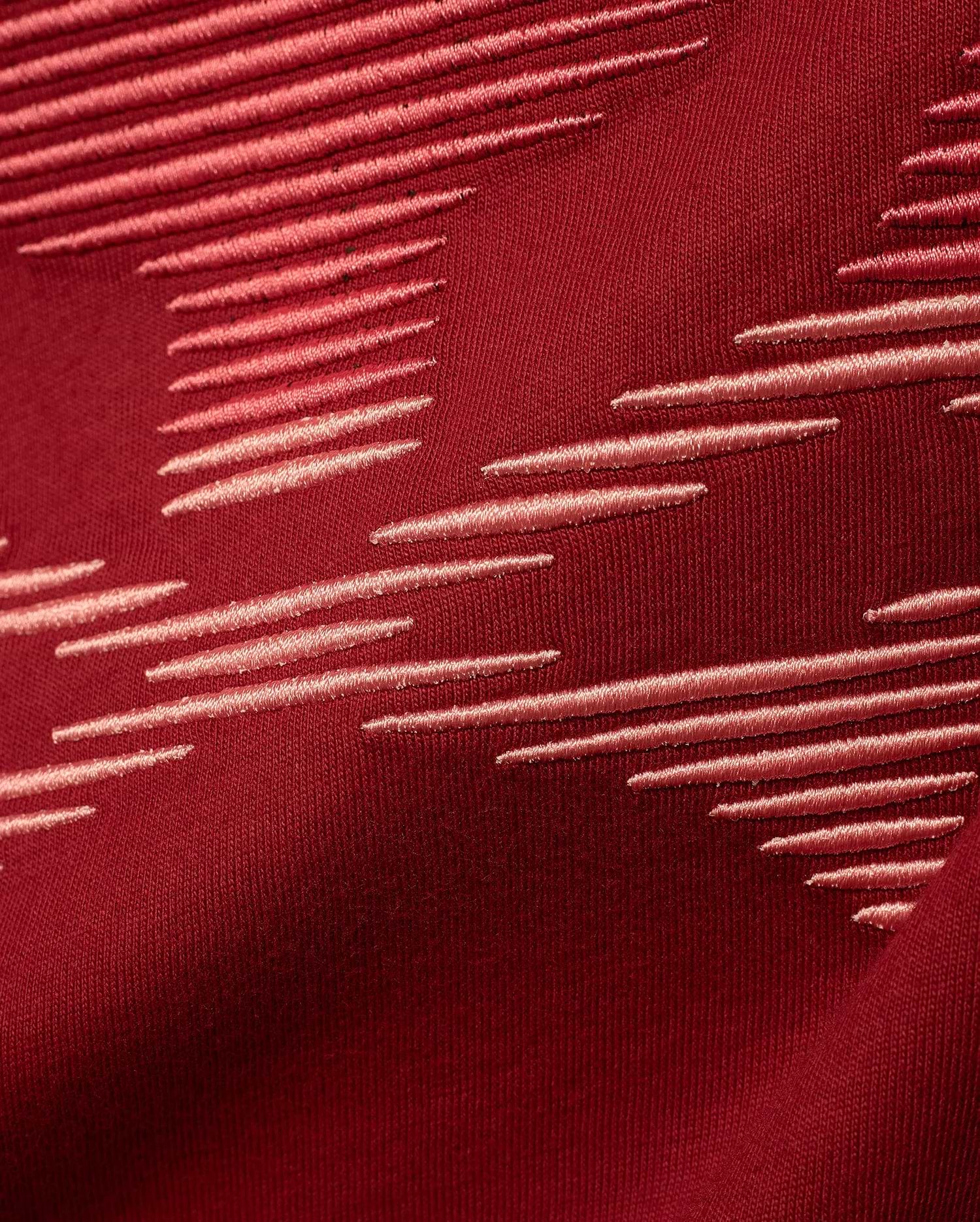 Men's Slade Bunny Graphic Tee in rich burgundy jersey knit, featuring a premium embroidered pattern of light pink horizontal dashes arranged dynamically across the fabric, reflecting refined streetwear style. (6)