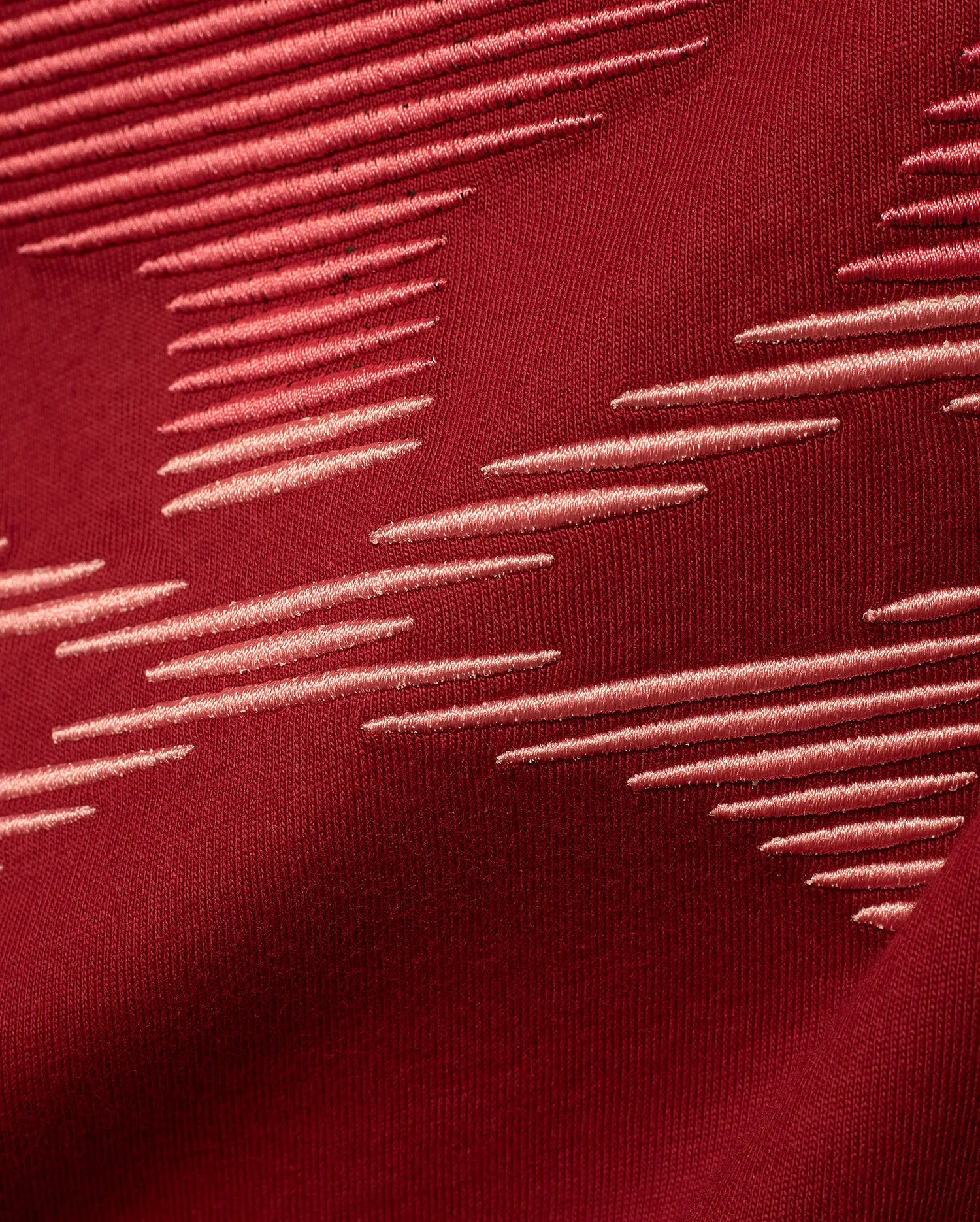 Men's Slade Bunny Graphic Tee in rich burgundy jersey knit, featuring a premium embroidered pattern of light pink horizontal dashes arranged dynamically across the fabric, reflecting refined streetwear style. (6)