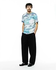 Psycho Bunny Men's Alfie All-Over Jacquard Tee, a premium relaxed fit t-shirt with a soft jersey texture and an abstract blue, white, and grey cloud-like pattern. (4)