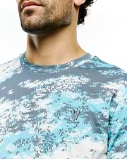 Men's Alfie All-Over Jacquard Tee with a blue, grey, and white digital camouflage jacquard knit pattern, featuring a small embroidered Psycho Bunny skull logo on the left chest. (2)