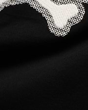 Men's Samson Graphic Tee: Black jersey knit with a large white textured graphic featuring a distinctive white cross-stitch outline, showcasing the iconic Psycho Bunny design. (6)