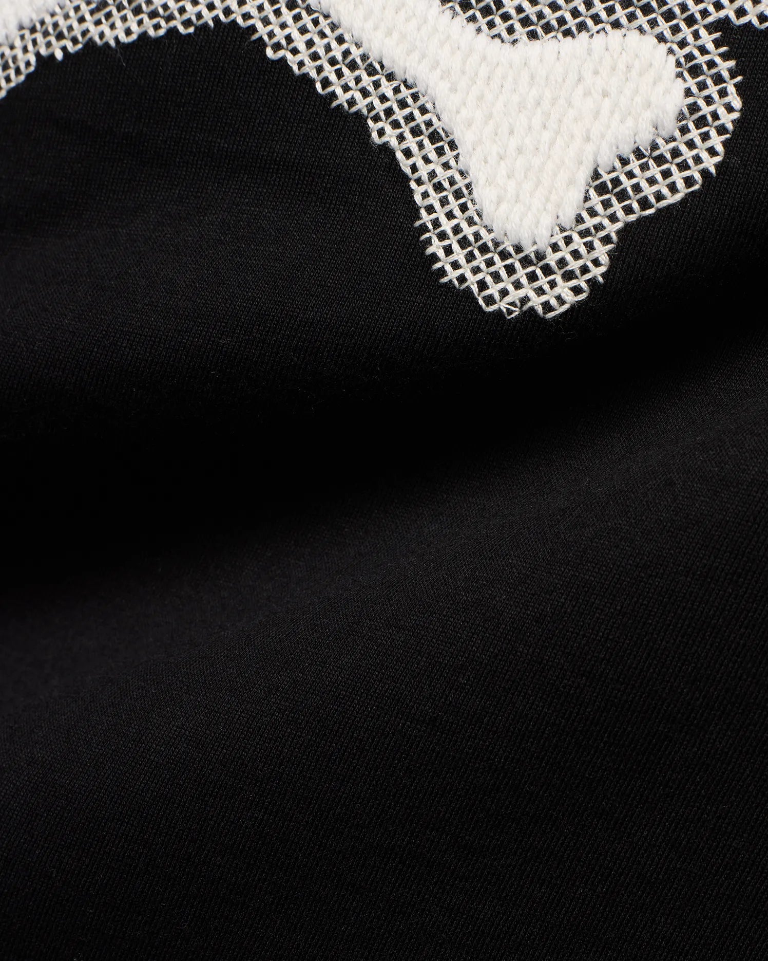 Men's Samson Graphic Tee: Black jersey knit with a large white textured graphic featuring a distinctive white cross-stitch outline, showcasing the iconic Psycho Bunny design. (6)