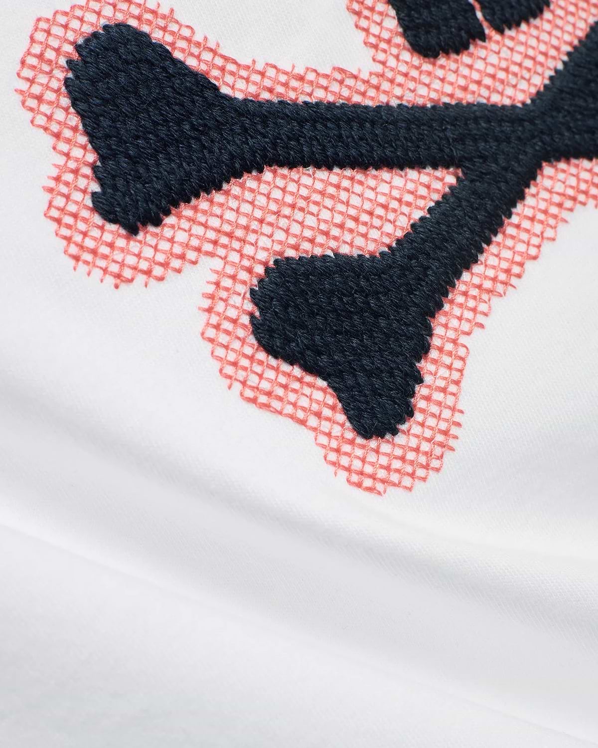 Men's Samson Graphic Tee in white soft jersey, featuring a prominent embroidered dark blue bunny skull logo with a coral cross-stitch outline. (6)