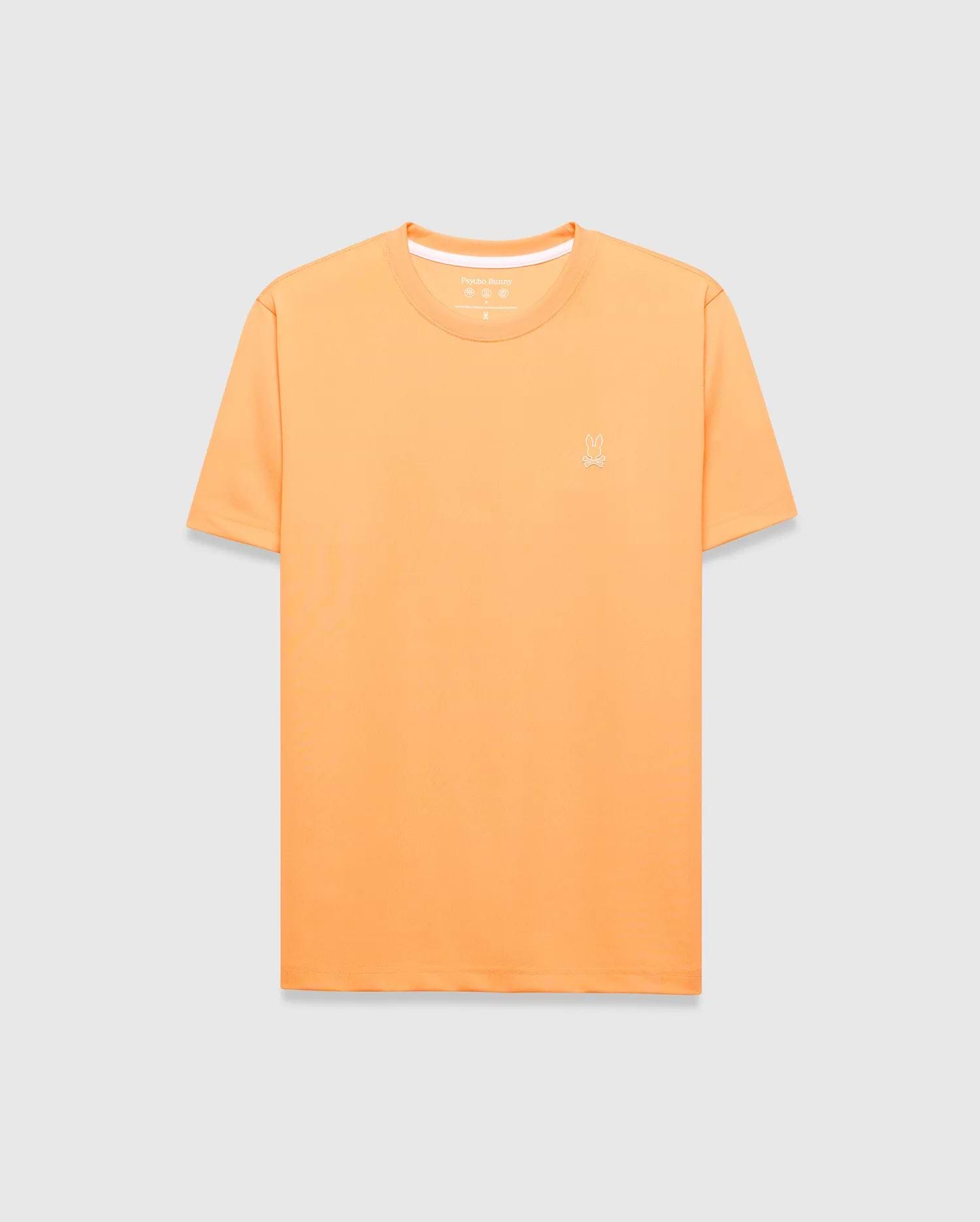 Mens Dash Bunny Sport Tee, a classic fit orange t-shirt made from smooth performance fabric, featuring a small white embroidered Psycho Bunny skull logo on the left chest and white inner collar trim. (5)