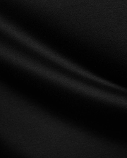 Psycho Bunny Mens Stevie Relaxed Fit Tee in deep black, made from smooth jersey fabric with subtle texture, featuring the iconic small embroidered bunny skull logo on the left chest.