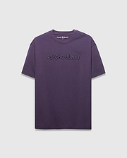 MENS WINDCREST RELAXED FIT TEE in deep plum jersey, featuring a large tonal embossed PSYCHO BUNNY text across the chest and a small embroidered bunny skull logo at the back neck.