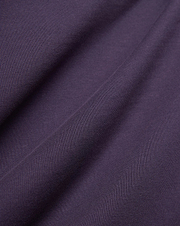Dark Purple Mens Windcrest Relaxed Fit Tee fabric, featuring a soft, finely ribbed jersey knit texture with subtle vertical lines and gentle folds.