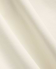 Mens Windcrest Relaxed Fit Tee in a soft, creamy off-white hue, showcasing its premium, smooth fine jersey knit fabric texture with elegant, flowing diagonal folds. (6)