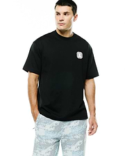 Men's Samson Oversized Bunny Tee in black jersey knit, featuring an embroidered white and silver Psycho Bunny skull logo on a textured square patch on the left chest. (1)