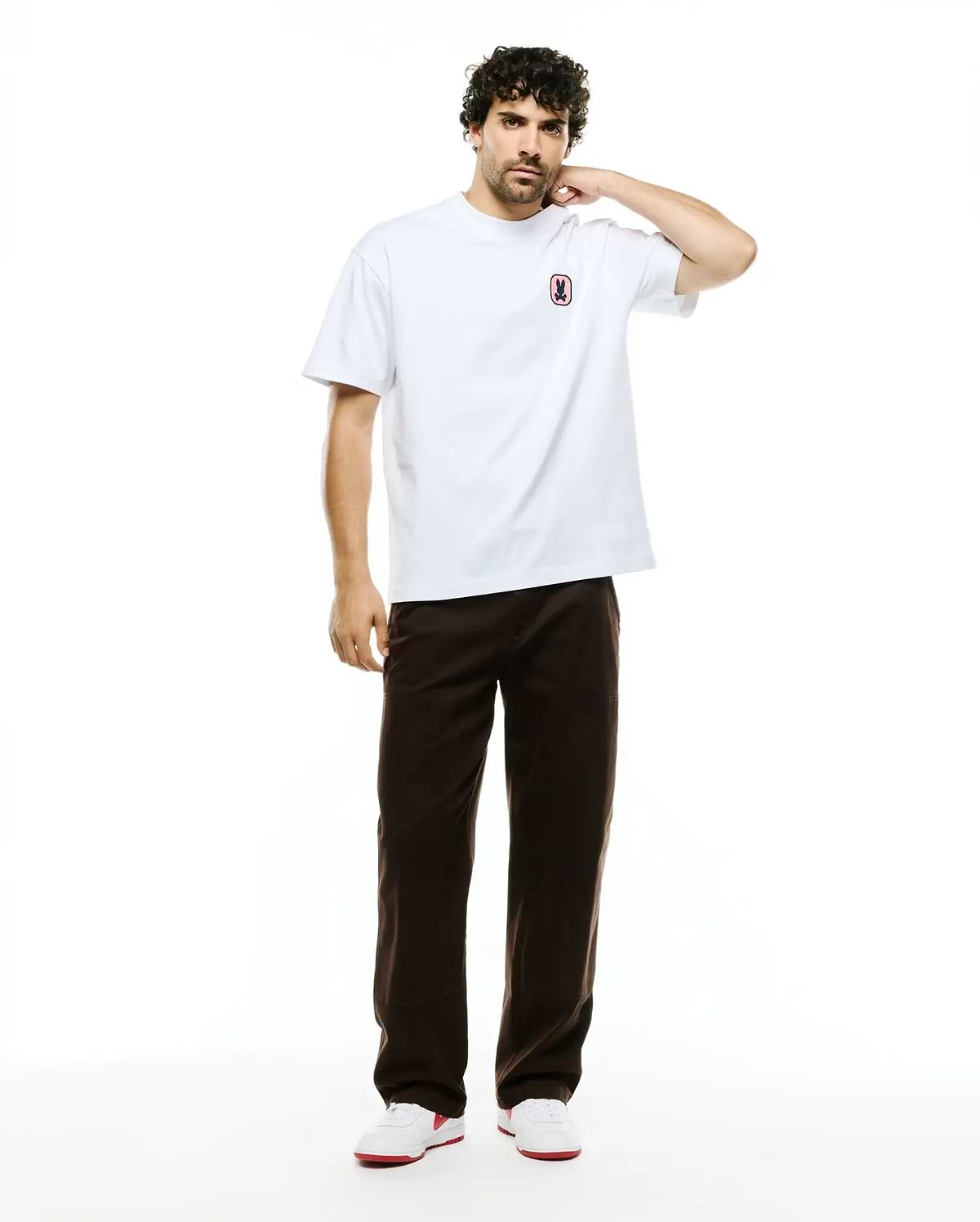 Men's Samson Oversized Bunny Tee, a white oversized smooth jersey t-shirt with a small, embroidered pink and black Psycho Bunny skull logo on the left chest. (4)