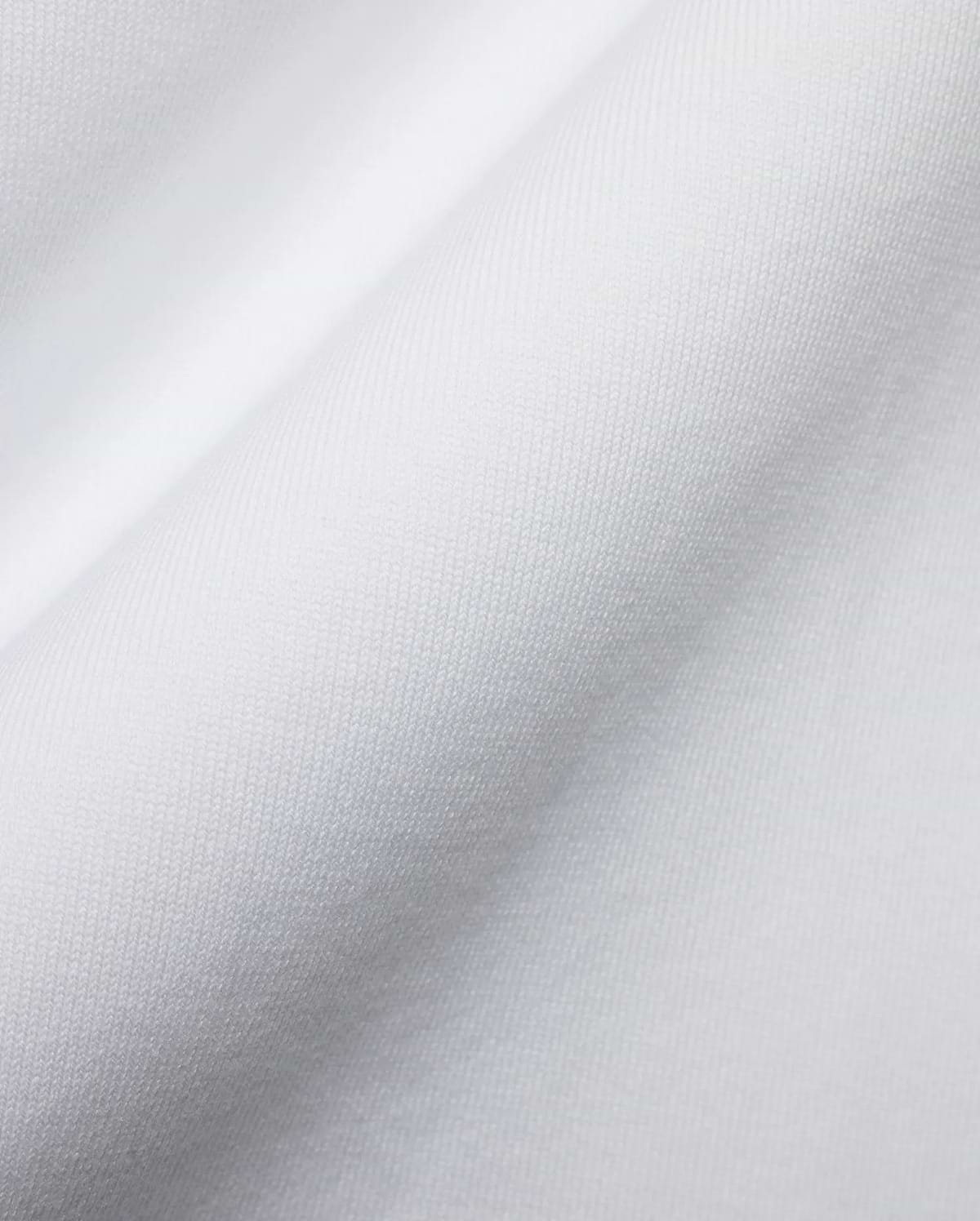 Men's Samson Oversized Bunny Tee, crafted from luxurious white jersey knit fabric with a fine, soft texture and subtle draping, reflecting Psycho Bunny's premium streetwear style and iconic bunny skull branding. (6)