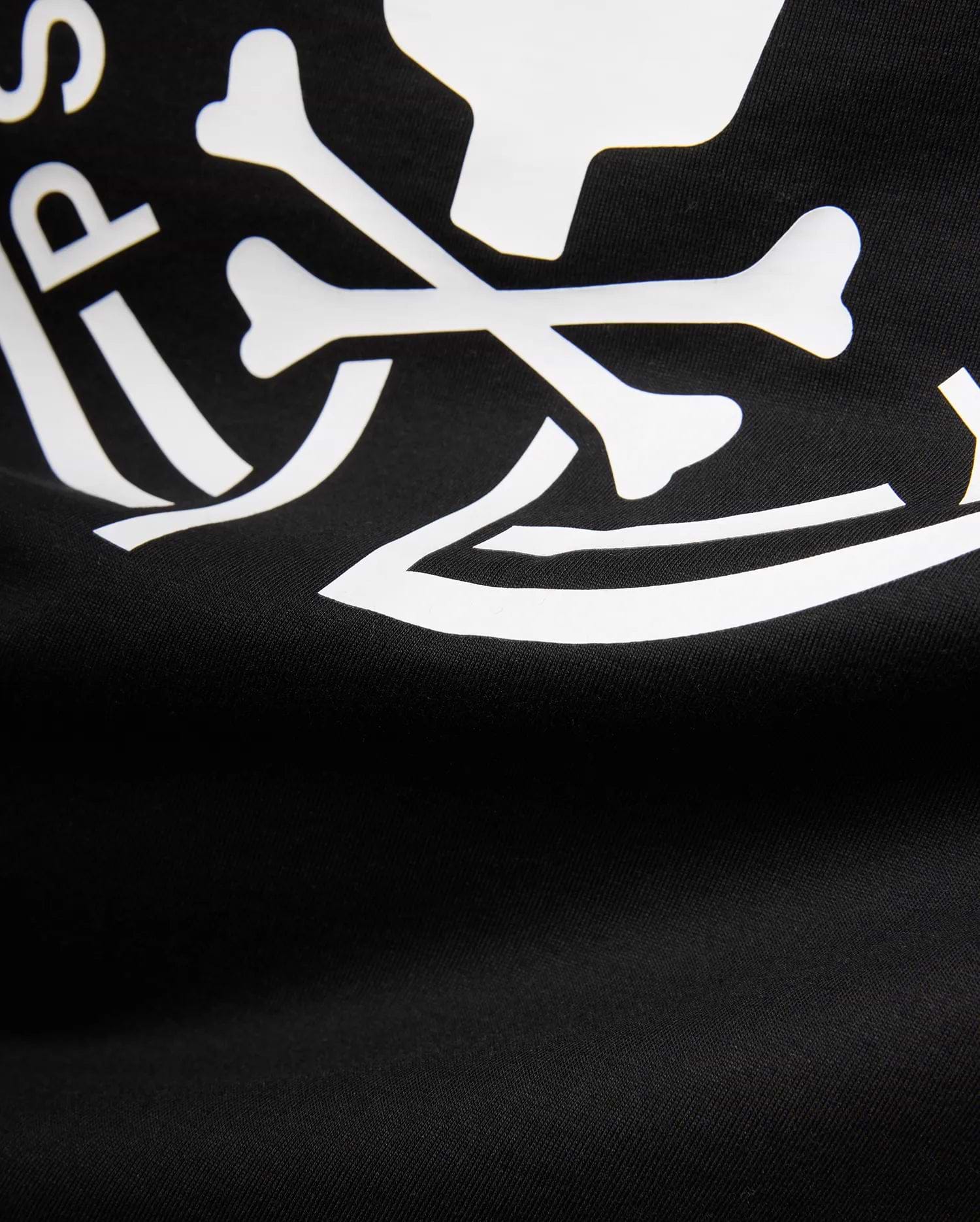 Mens Santa Fe Bunny Graphic Tee, a black jersey knit t-shirt featuring a bold white graphic print of crossbones and partial Psycho Bunny logo text.