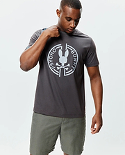 Mens Santa Fe Bunny Graphic Tee, a dark grey classic fit jersey t-shirt featuring a large white circular Psycho Bunny skull logo and text graphic centered on the chest. (2)