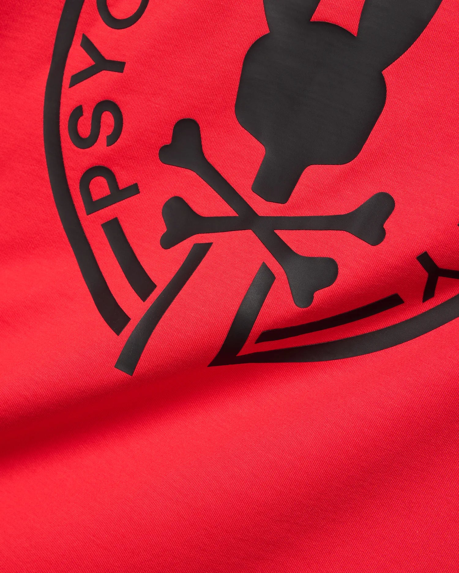 Mens Santa Fe Bunny Graphic Tee, a vibrant red jersey t-shirt featuring a large, central black rubberized Psycho Bunny skull and crossbones graphic with PSYCHO BUNNY text. (6)